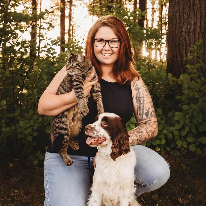 Emily C. with her cat and dog